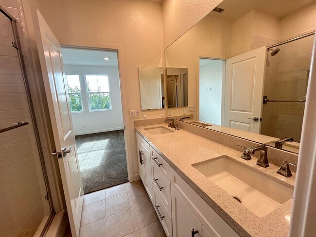 Building Photo - Gorgeous, 3 level townhome, featuring 2 car garage central Air, and in Unit laundry.