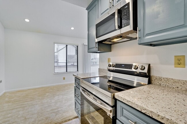 Building Photo - Spacious condo available in desirable Newpark Village community!