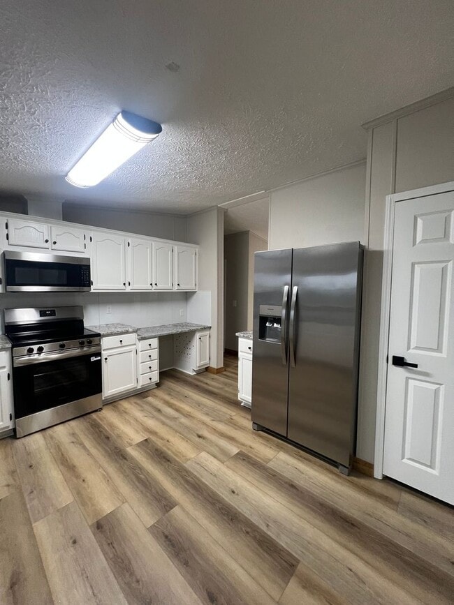 Building Photo - Peaceful Country Living on 1.4 Acres Beautifully Remodeled 3 Bed / 2 Bath Home on Ficklin Road