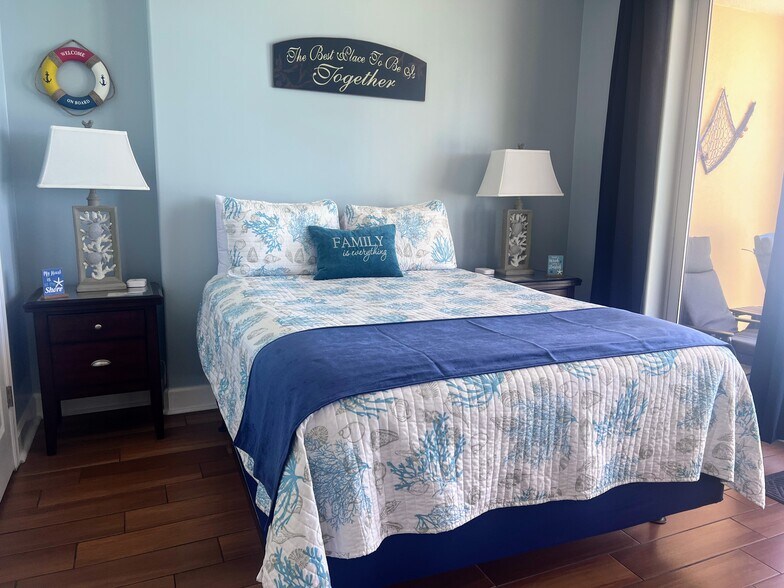 Master bedroom with QUEEN bed and DARKENING curtains to sleep in comfortable! - 10625 Front Beach Rd