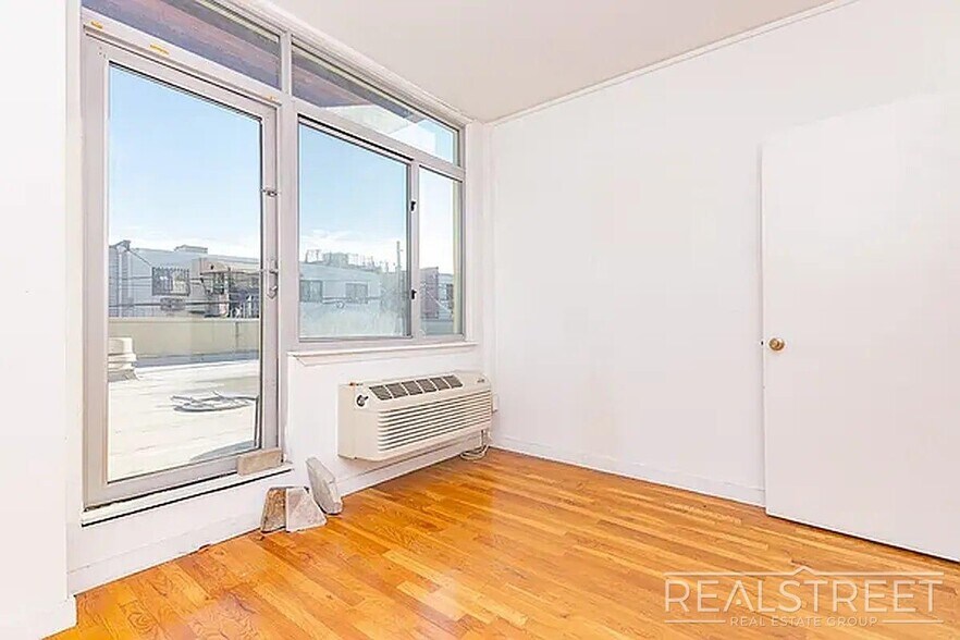 Building Photo - Massive Outdoor Patio | Spacious 3BR/2BA Apartment in Bushwick–East Williamsburg