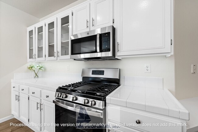 Building Photo - Welcome to this stunning 2-bedroom condo in gated community