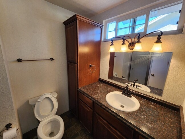 Building Photo - Adorable 4/2 With GREAT Backyard.  Gardene...