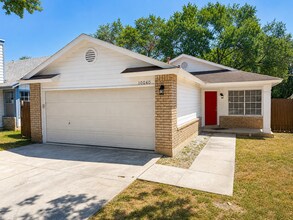 Building Photo - Move-In Ready 3BR/2BA: Updated Kitchen, New Light Fixtures & Fenced Yard