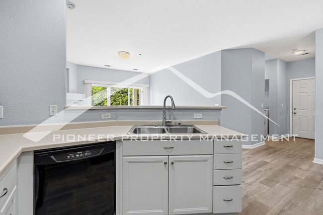 Building Photo - Spacious Condo with Central AC, Covered Parking, and Washer/Dryer