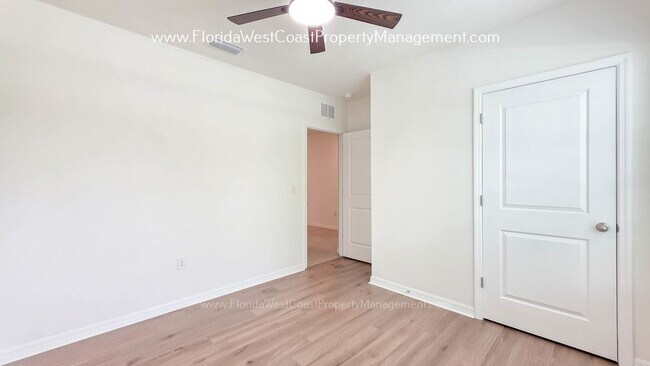 Building Photo - MOVE IN READY ! 4 BEDROOM/2 BATH! TILE- LVP THROUGHOUT! LAWN MOWING INCLUDED!