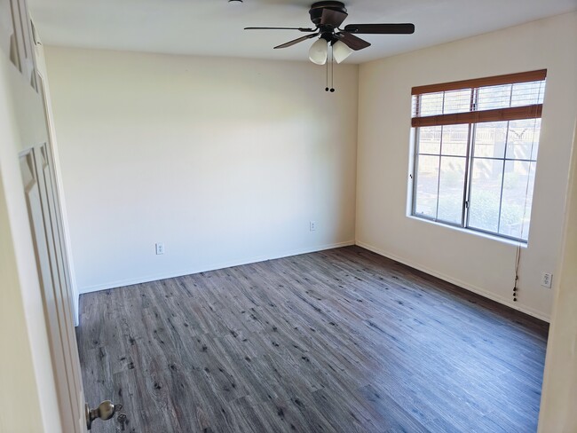 1st floor master room, new wood looking vinyl flooring. - 900 S 94th St