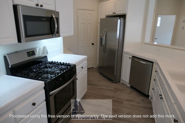 Building Photo - Welcome to this stunning 2-bedroom condo in gated community