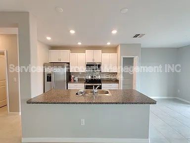 Building Photo - 7412 French Marigold Ave.