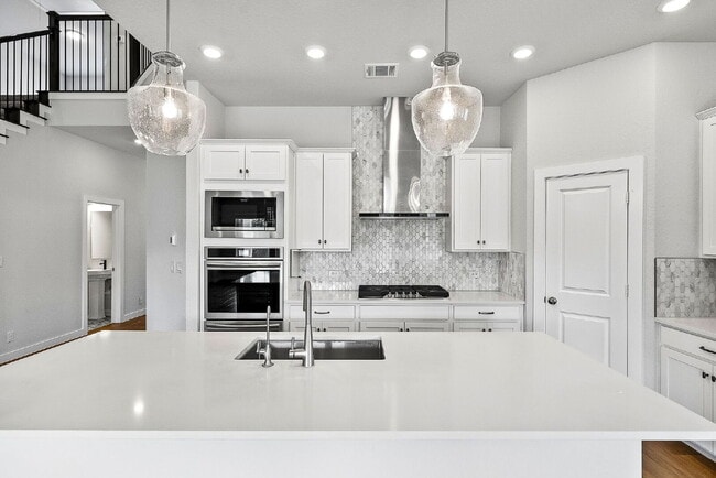 Building Photo - Greenbelt. 3 Car Garage. Built In Dog Room.