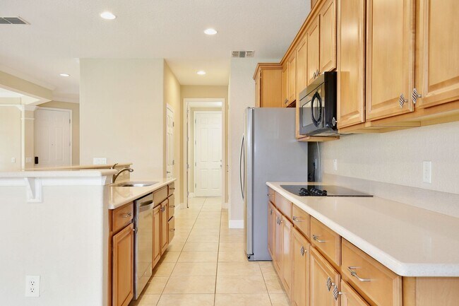Building Photo - Stylish and Spacious 3/2.5 Townhome with Premium Features and Community Pools