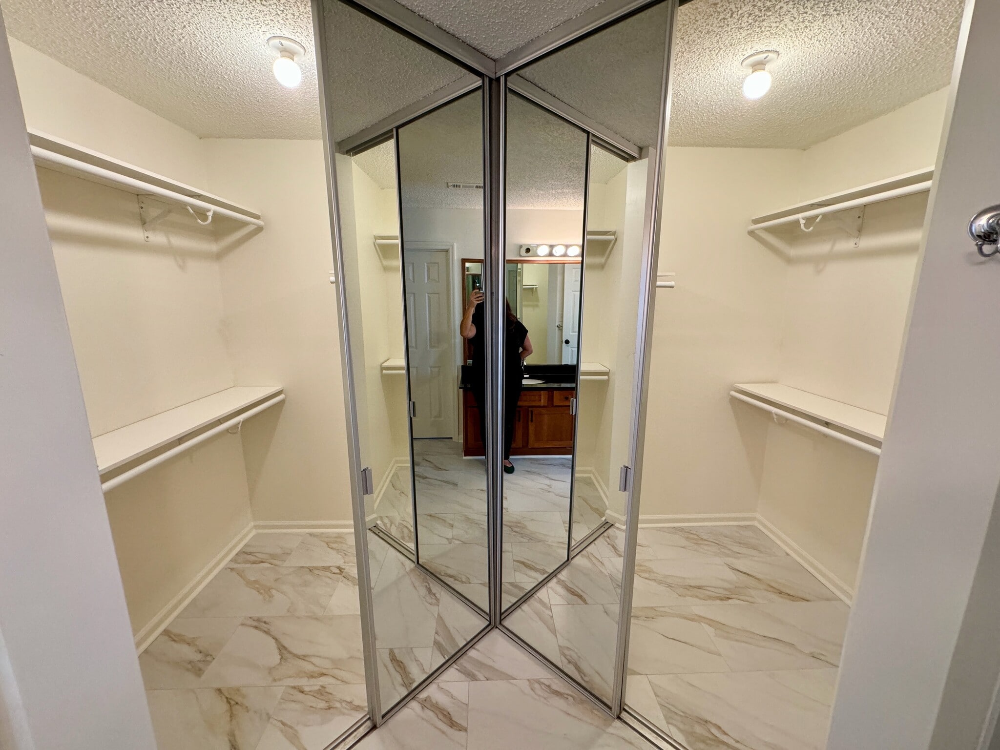 large walk-in closet with double, full-length, mirrored doors - 209 14th St. NE #119