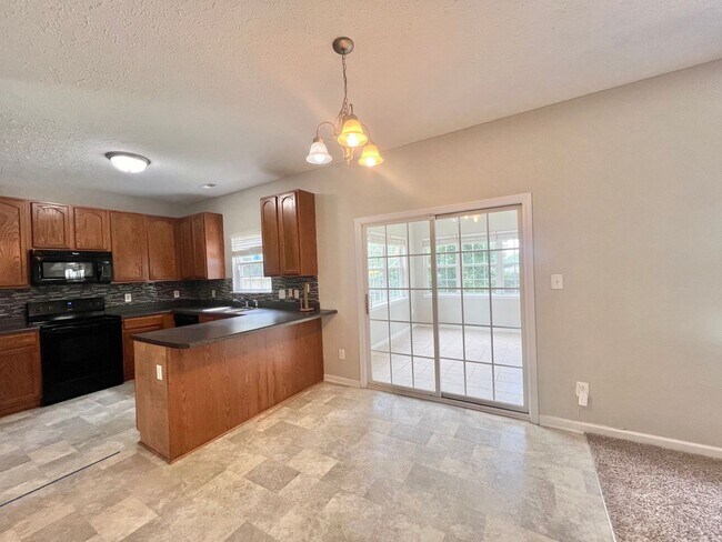 Building Photo - Charming 4BD, 2.5BA Durham Home with a Bonus Sun-Room & Fenced In Yard Only 10 Minutes Away from ...