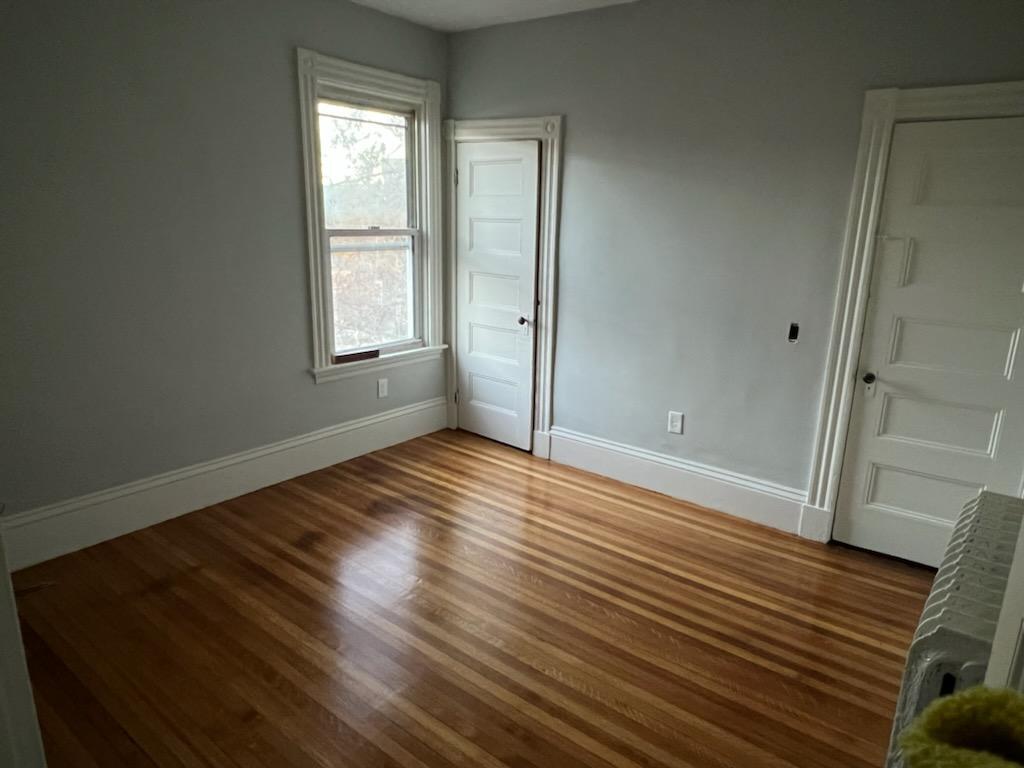 One of 3 bedrooms with hardwood floors - 56 State St