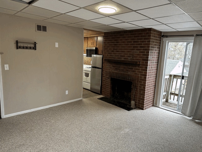 Leaving room with the fireplace - 834 S Walnut St