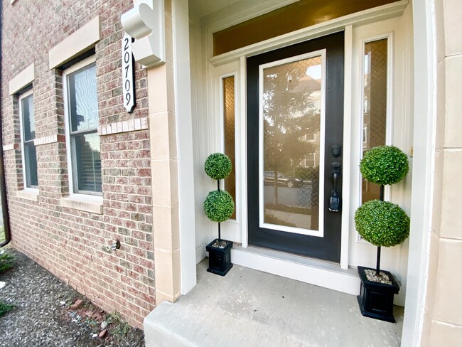 INVITING ENTRY TO FOUR FLOORS - 20709 Duxbury Ter