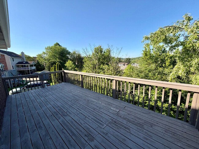 Building Photo - Modern Comforts Await: Spacious Rental with 2-Car Garage, Private Office, and Finished Basement w...