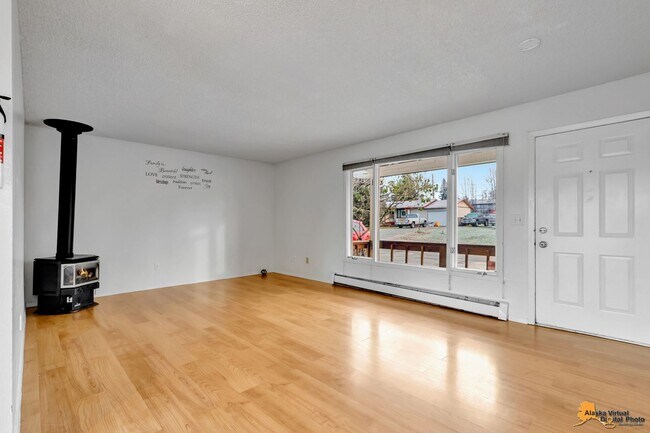 Building Photo - Cozy Abbott Loop Single Family Home w/ Garage & Fenced in Yard