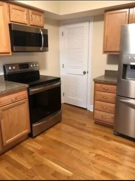 Another perspective of the kitchen, and the door to the basement - 1149 Cooper Dr