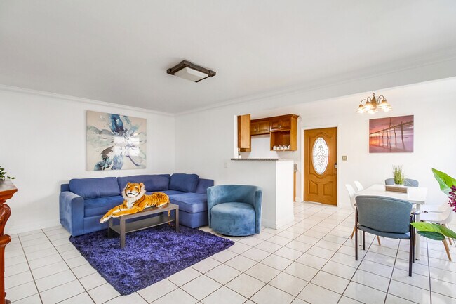 After a day exploring Balboa Park, unwind on the soft blue-themed sofa - 2304 E 14th St