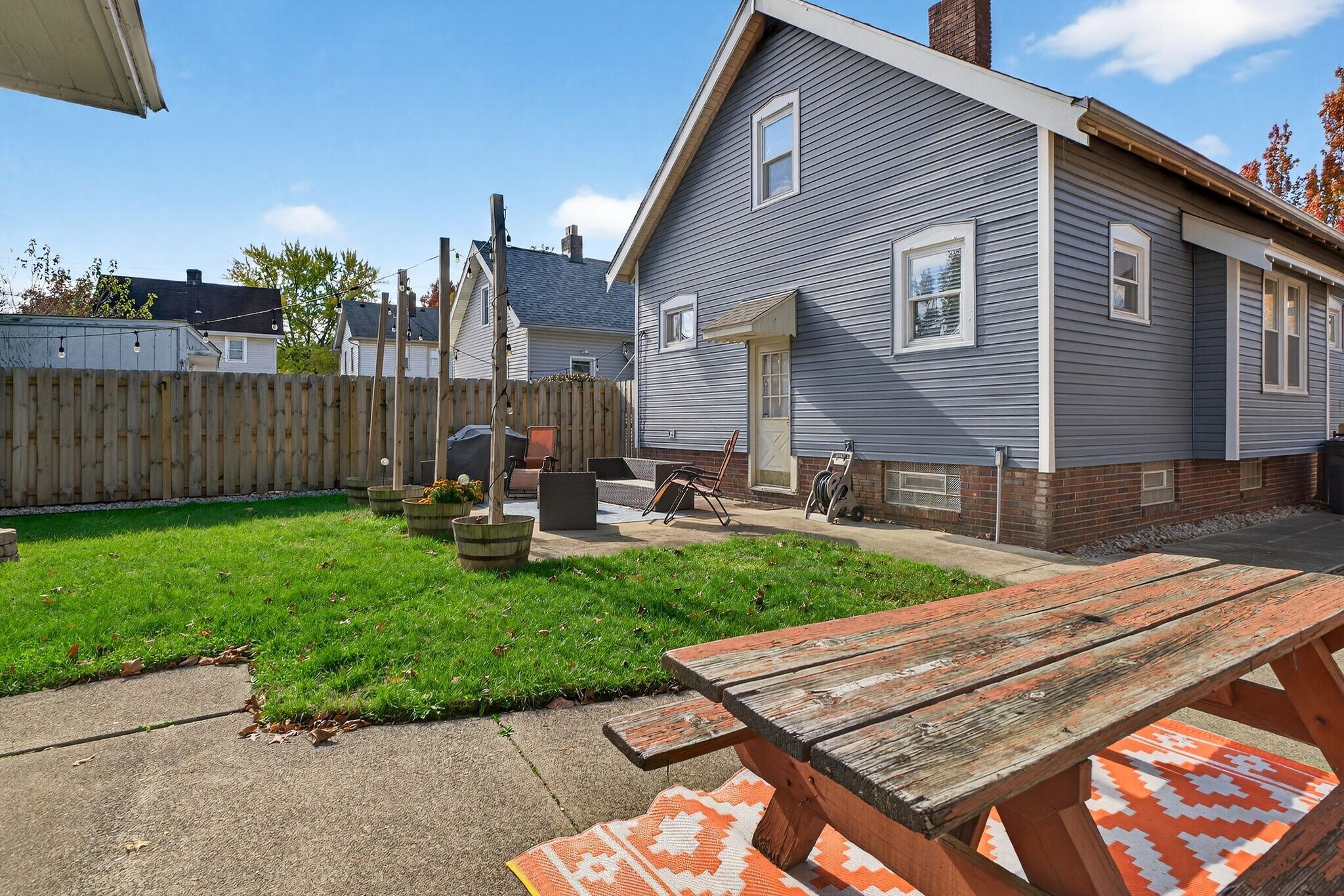 Backyard with Fenced in Yard and String Lights - 4429 S Hills Dr