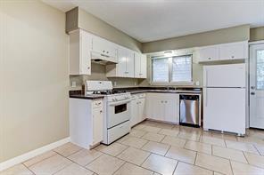Updated kitchen with tile floors, gas cooking, dishwasher and access to your large backyard. - 4609 Nina Lee Ln