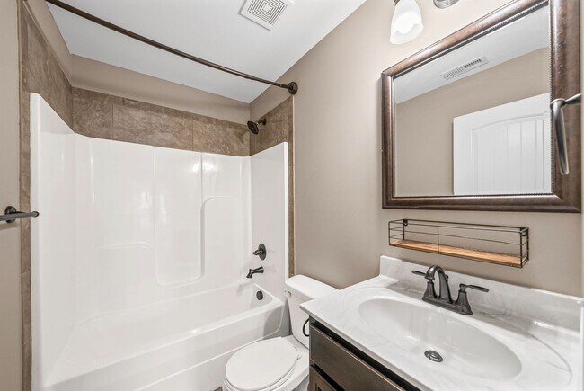 Building Photo - Four Bedroom with Three Car Garage!