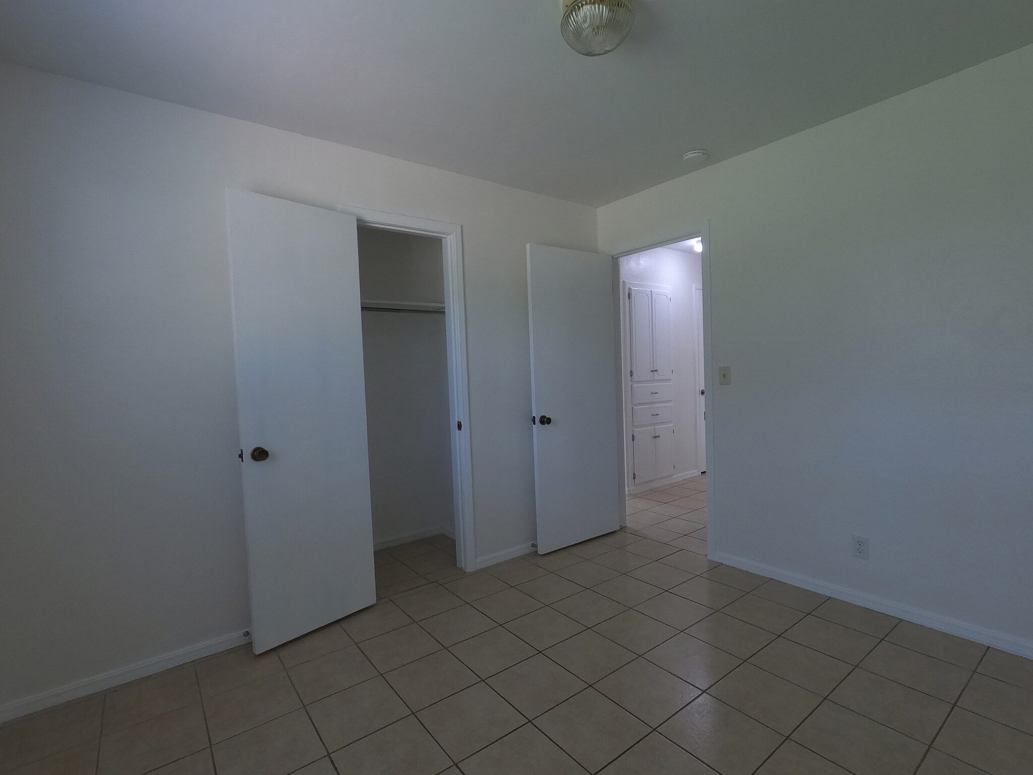 Northwest bedroom closet with door to hall - 415 W Guthrie St