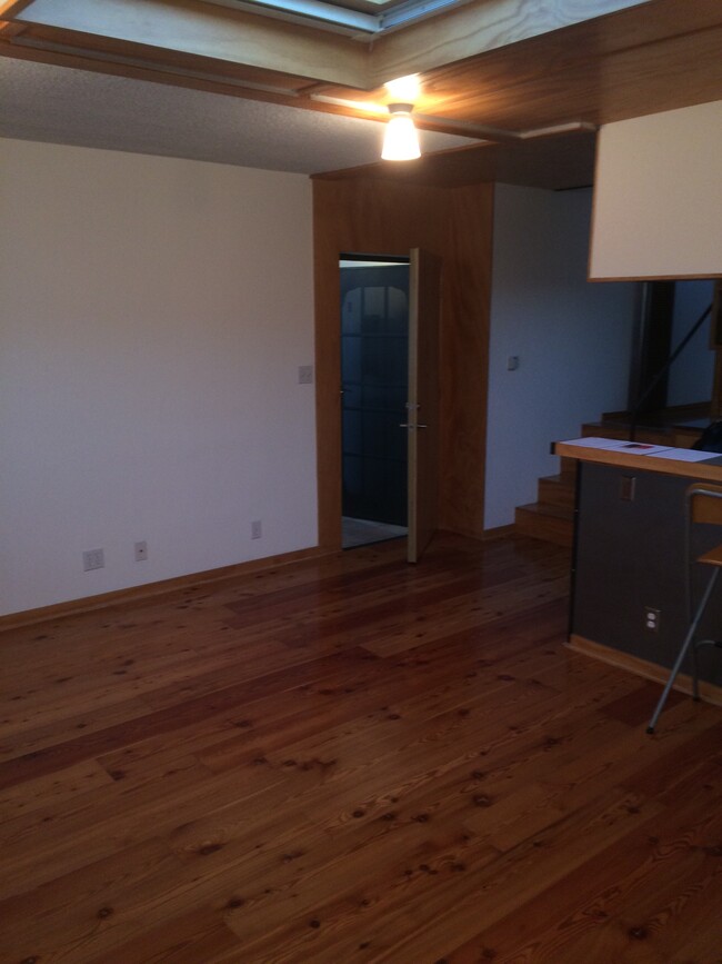 Living room with front door ajar - 1524 10th St