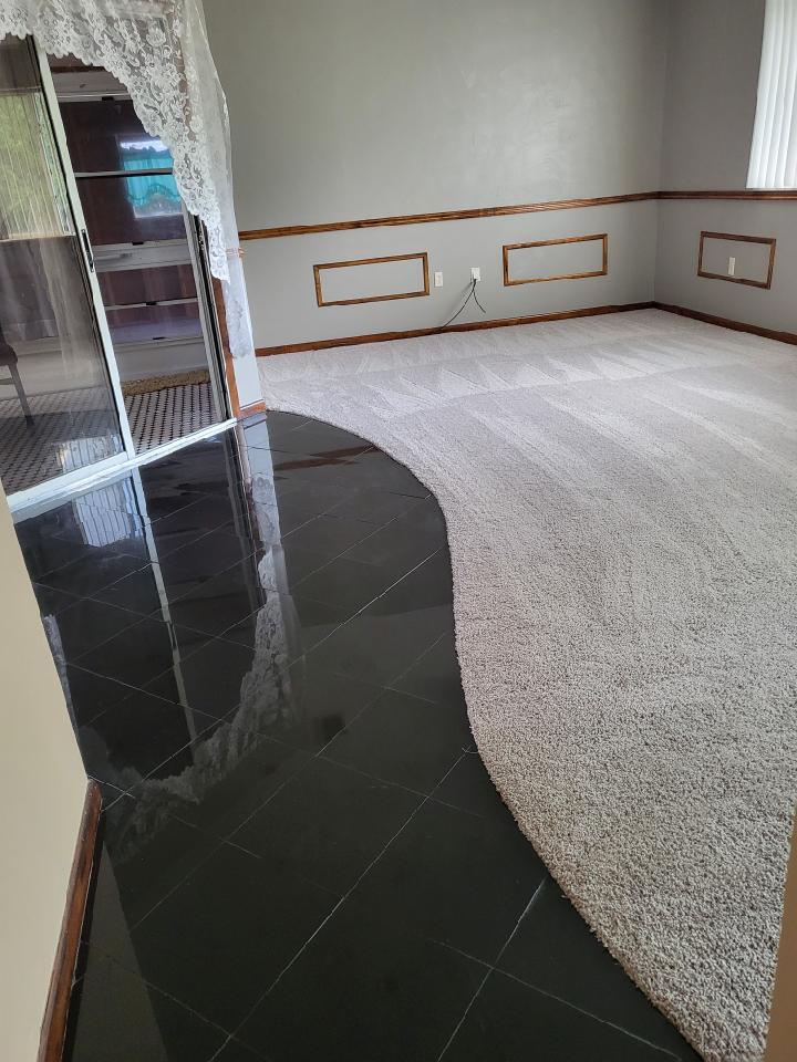 Granite floors and carpeted living area hallway - 10871 SW 90th Ct