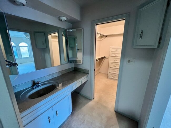 Building Photo - Step into this inviting, sunlit home where space and comfort blend seamlessly