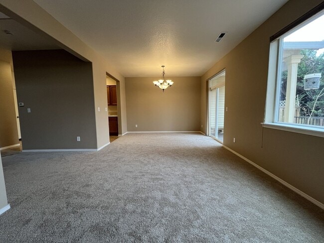 Building Photo - Inviting Two-Story 3BR Home Featuring New Carpet, New Stainless Appliances, Spacious Garage Stora...