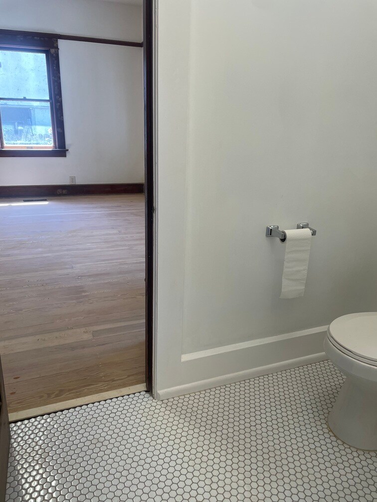 Completely renovated half bathroom that is the smallest of the three bathrooms. - 1135 Magnolia St