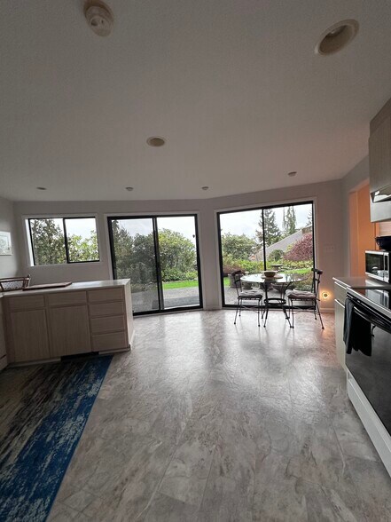 Well equipped kitchen with private patio with view of Ranier and partial water view. - 4439 54th Ave SW