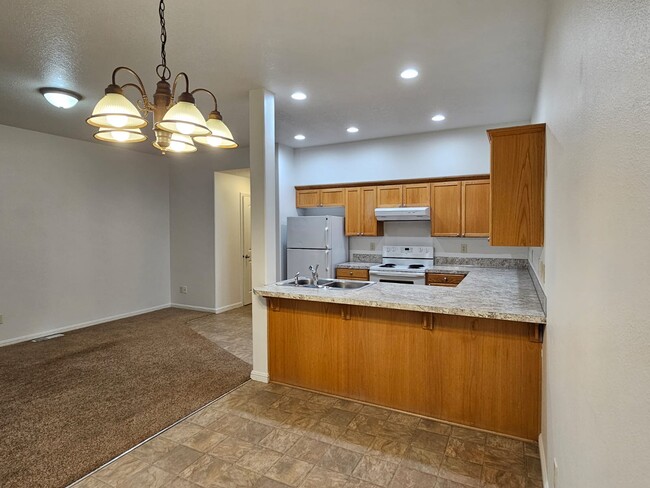 View into Living room and kitchen from dining area - 528 Fenton Ave