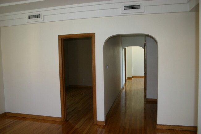 Middle bedroom door and hallway to dining room. - 110 N 3rd St