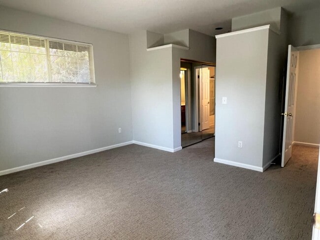 Building Photo - Spacious 2BR/2BA Redwood Shores Condo with Balcony, Natural Light & Garage Parking