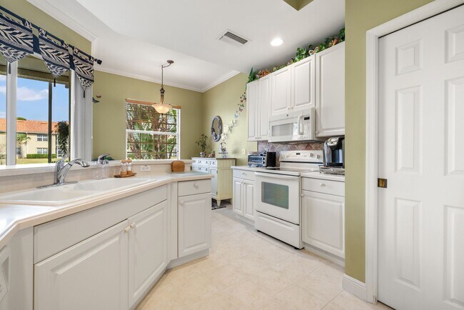 Building Photo - Experience Bell Tower Park. GATED ground floor 2 Bed 2 Bath Den 1 Car Garage Condo.