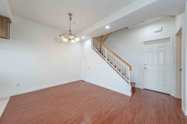 Building Photo - Gated Townhome with Updated Kitchen and Private Backyard
