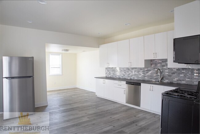 Building Photo - Updated 4BR House with 2 full baths and yard!