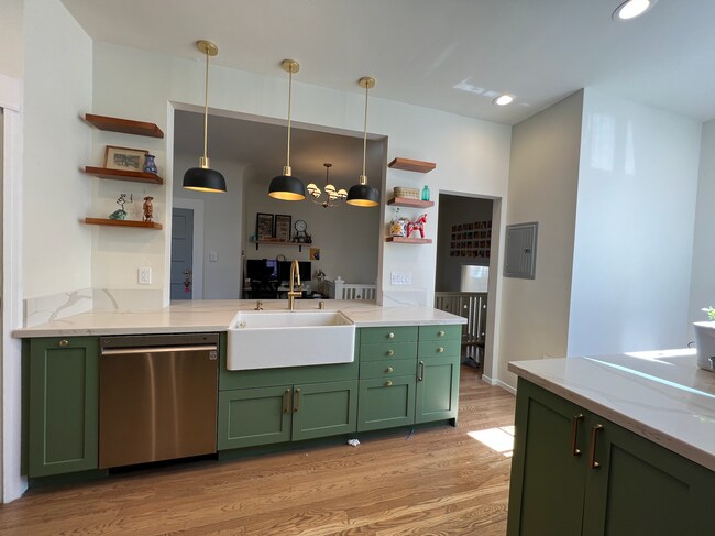 36" fireclay sink with open shelves and Rejuvenation pendant lamps - 37 Alma St