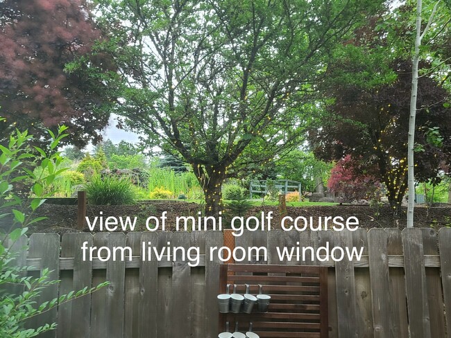 View of mini golf green space and back patio - 11440 SE Aquila St