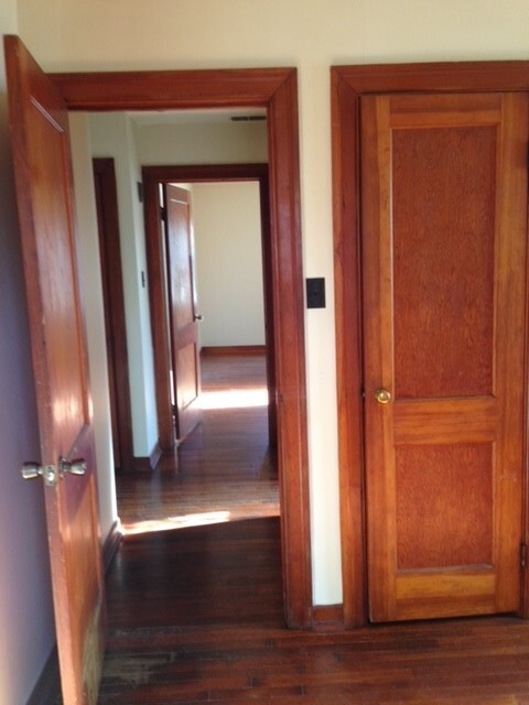 2nd bedroom look into hallway and bedroom one, bathroom outside the door on the right - 1409 N Woodburn Ave