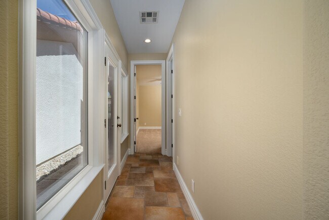 Secondary bedrooms are in separate wing with their own courtyard entrance. - 2850 Bronzino Ct