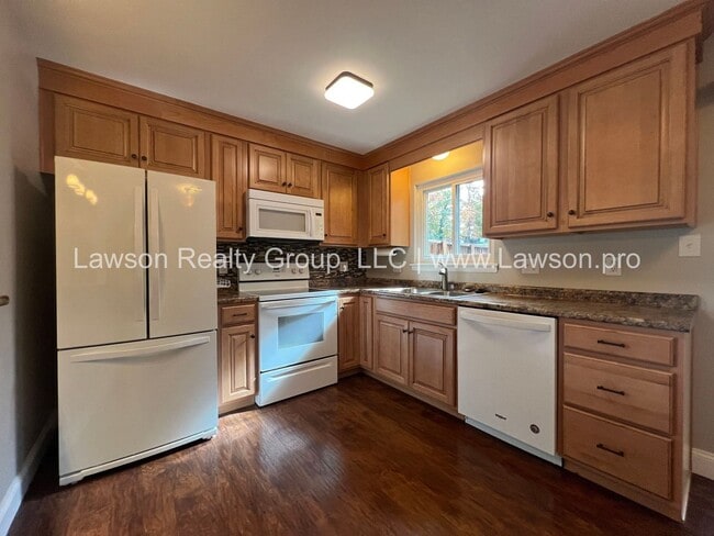 Building Photo - Charming Brick Ranch with Beautifully Landscaped Yard and Attached Carport