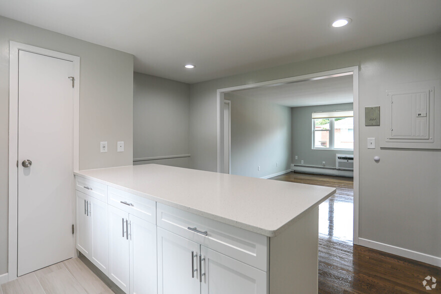 Kitchen and living space. - Emerson Arms Apartments