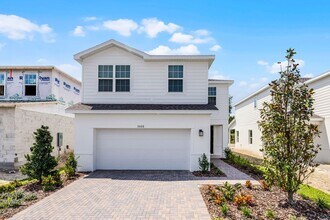 Building Photo - Brand-New 4BR Home with Tile Floors & Quar...