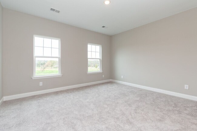 Building Photo - **BE THE LUCKY ONE TO LIVE IN THIS 2022-BUILT UPSCALE COTTAGE HOME IN THE PRESERVE AT BELLE POINTE**