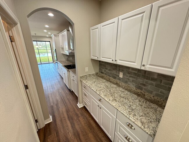 Building Photo - $300 off of a month of rent!! Experience the Epitome of Lakeside Luxury Living — For Rent in Narc...
