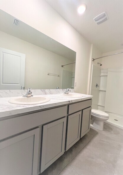 Primary bathroom with double vanity - 5247 Dragonfly Dr